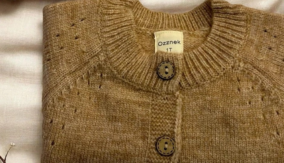 Premium organic cotton toddler cardigan in hazel brown — folded flat lay