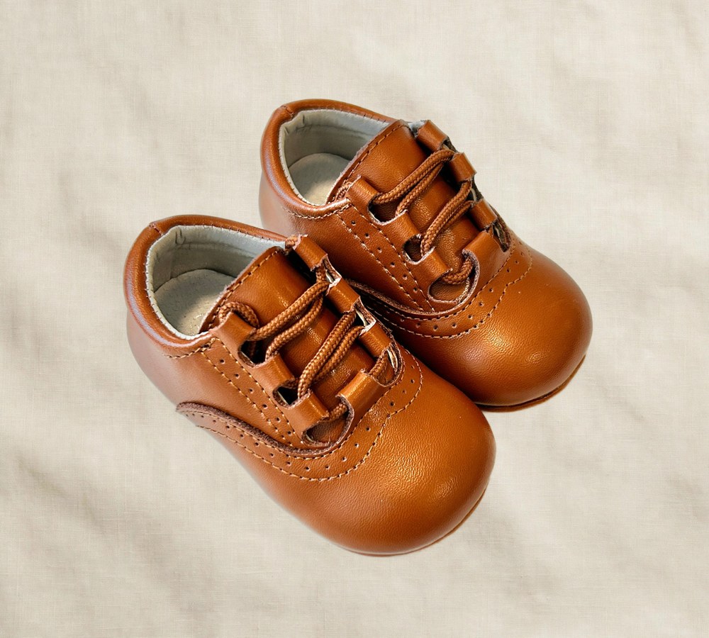 Alfie Lace-up Dress Shoe for Kids, Wide Toe Box on cream linen background