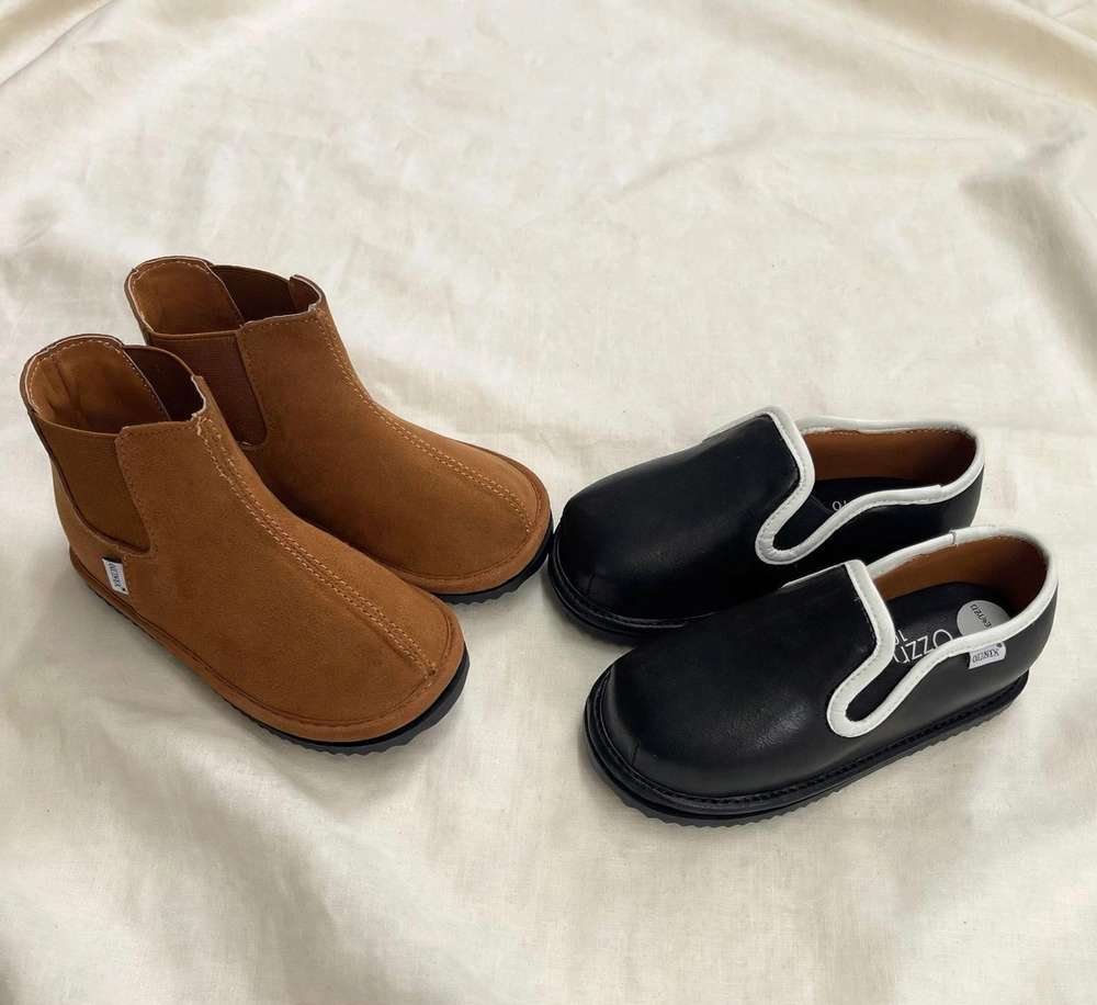 The David Bundle: 2 Pairs of Easy-On Barefoot Kids' Shoes on cream linen background
