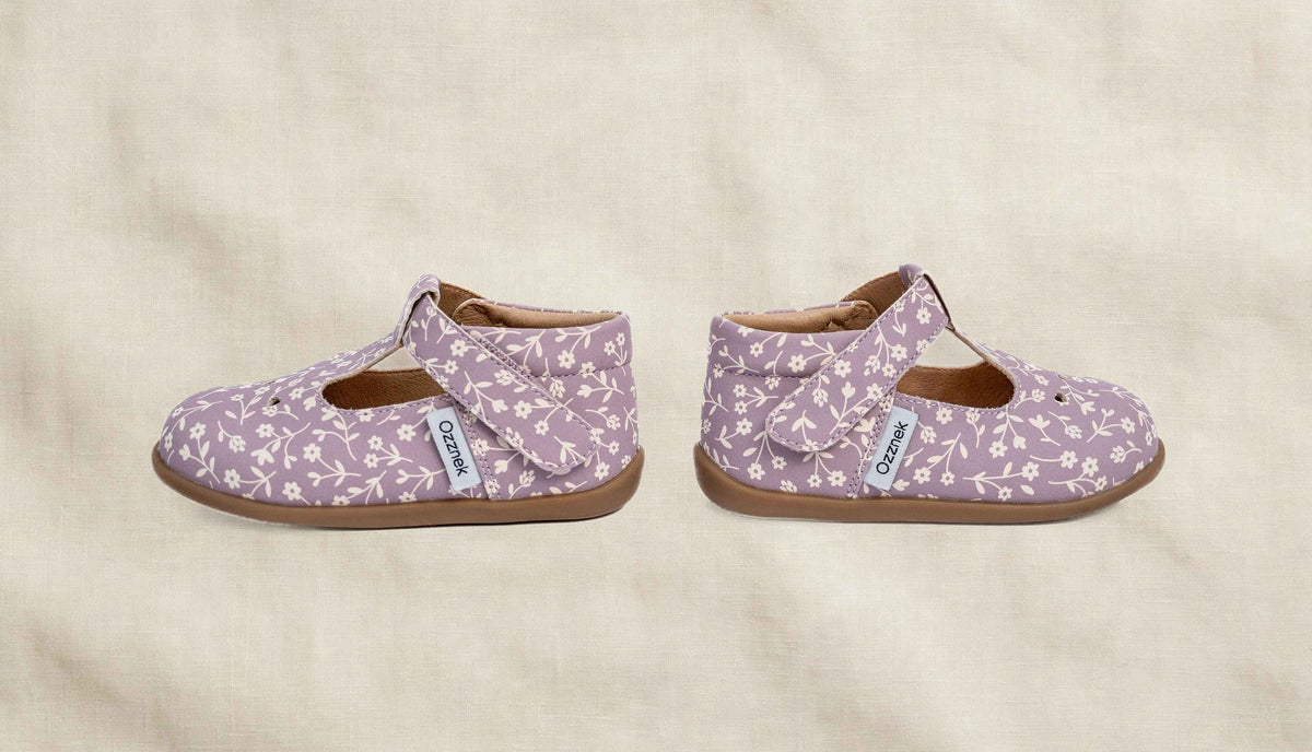 Ava Blossom Kids' Barefoot Mary Janes | Floral T-Strap Toddler Shoes on cream linen background