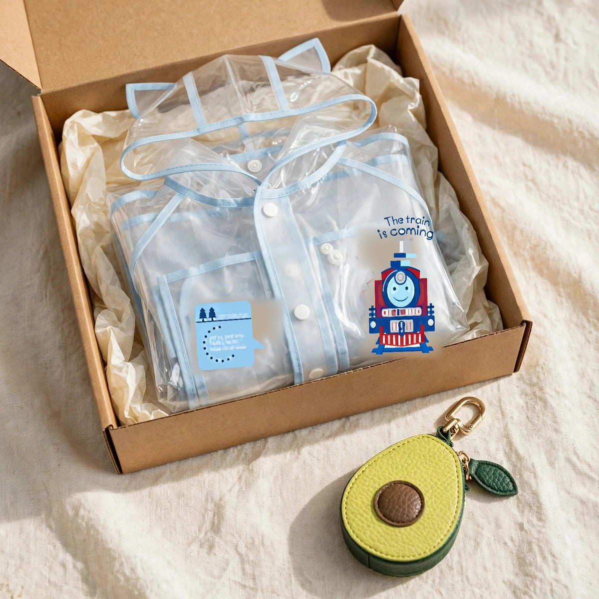 Kids gift set with clear baby blue raincoat and avocado leather fruit bag charm in a gift box, toddler rain gear Christmas gift