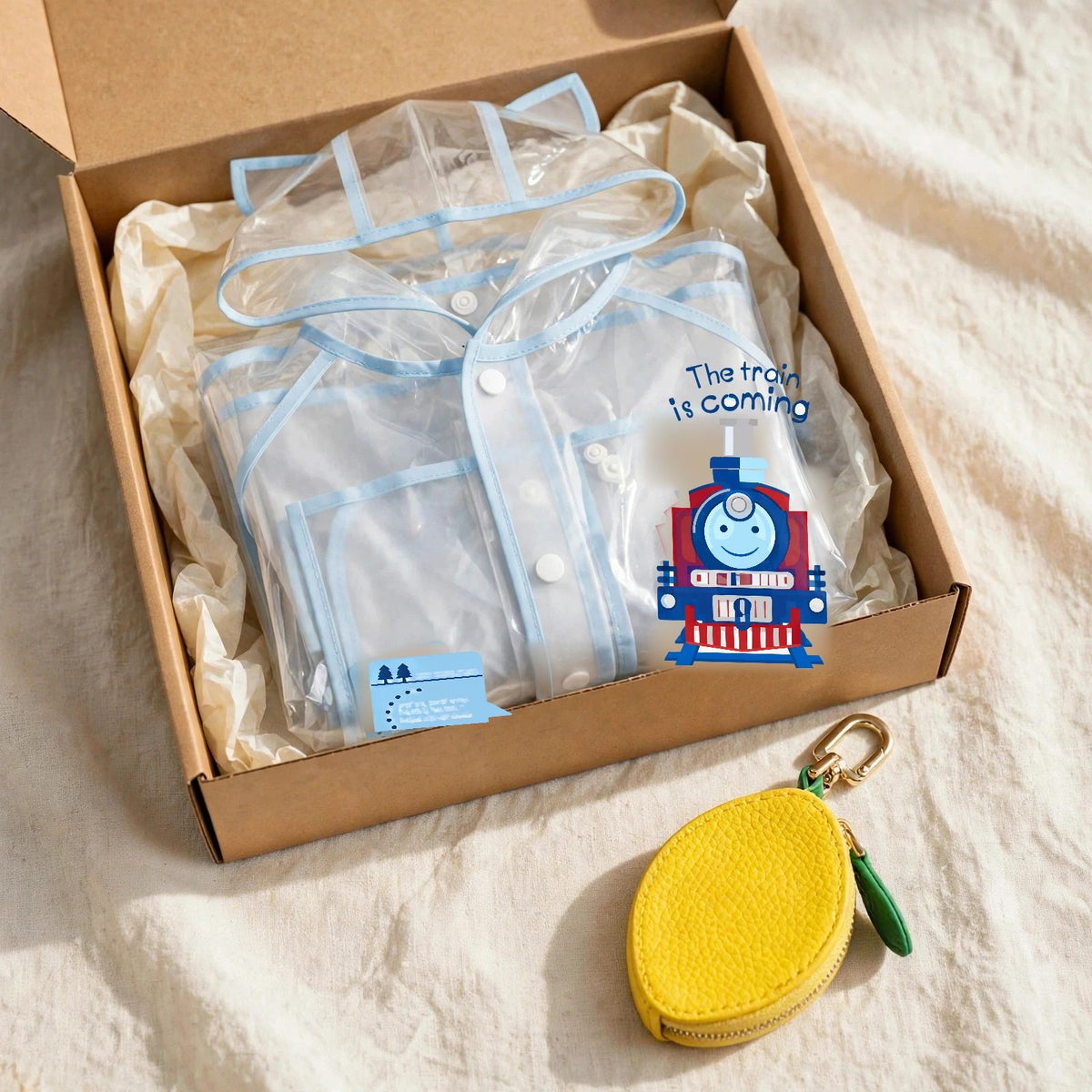 Kids gift set with clear baby blue raincoat and lemon leather fruit bag charm in a gift box, toddler rain gear Christmas gift