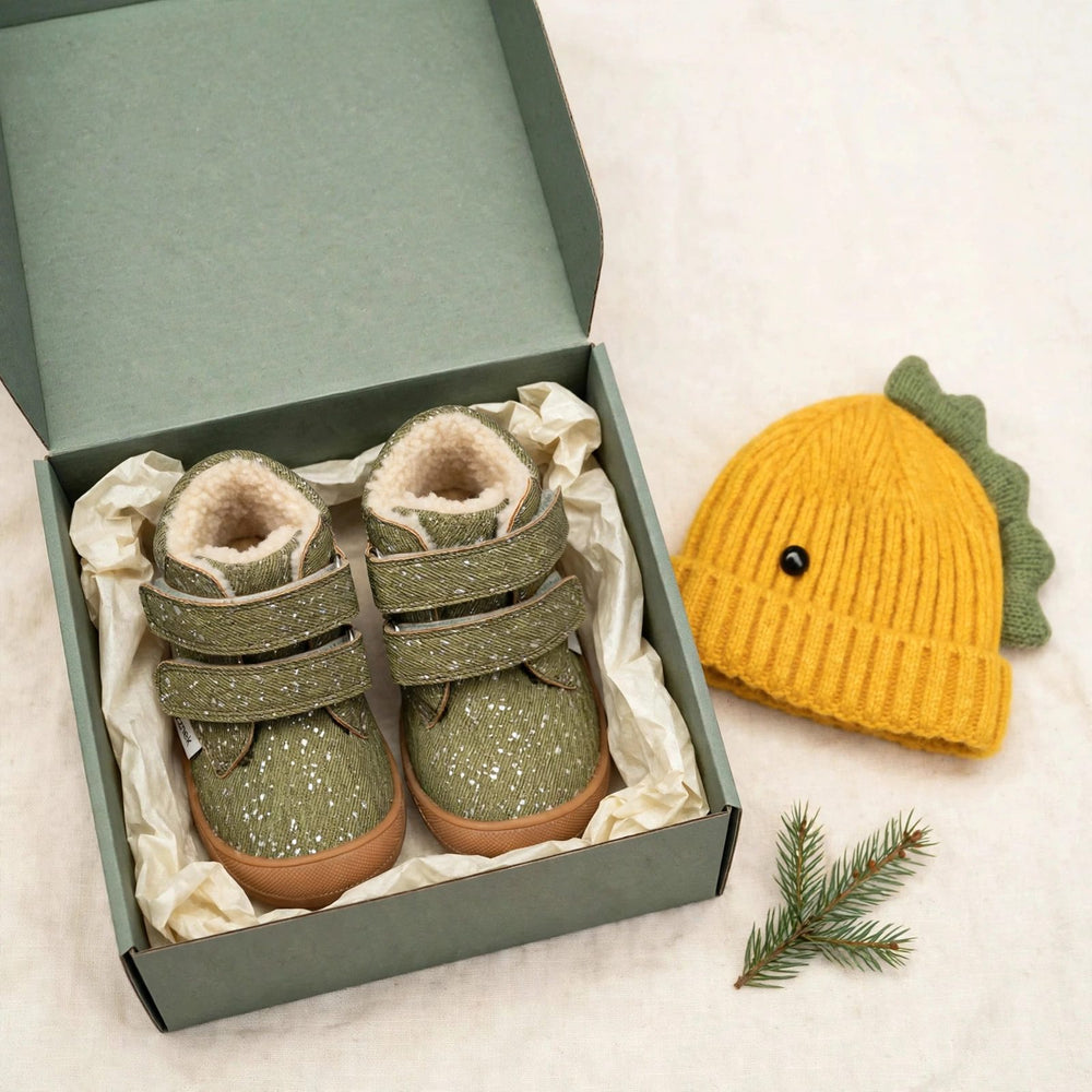 Little Hiker and dinosaur beanie gift set for toddlers - forest green barefoot winter boots and knitted dino beanie in a gift box