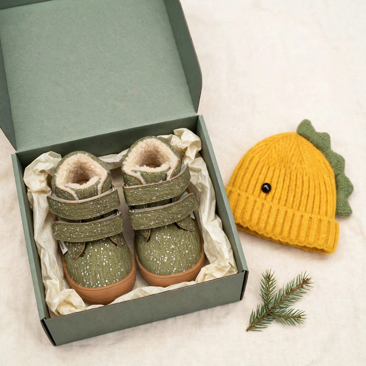 Little Hiker and dinosaur beanie gift set for toddlers - forest green barefoot winter boots and knitted dino beanie in a gift box