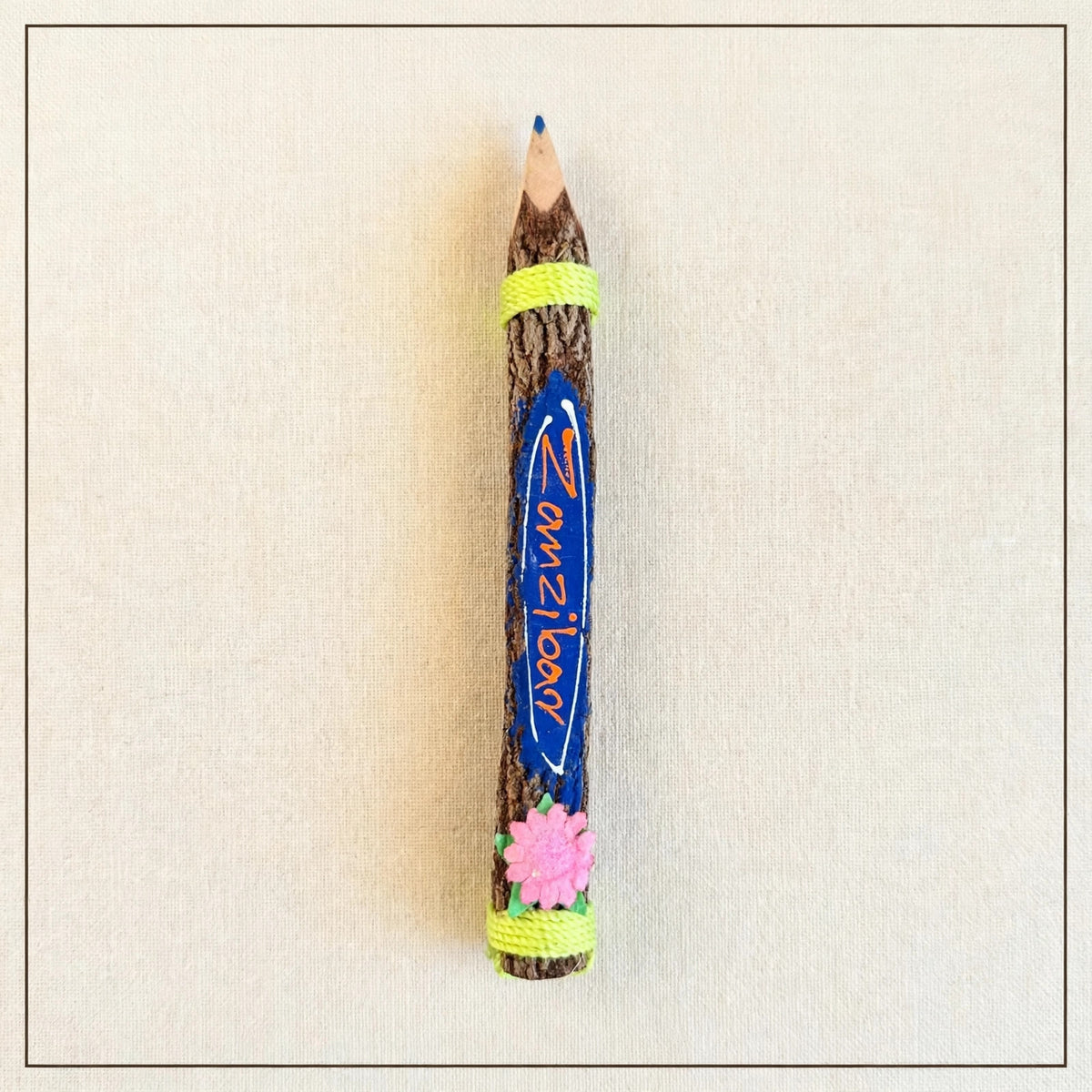 Big royal blue hand-carved wooden coloring pencil with the hand-painted word Zanzibar, blue tip