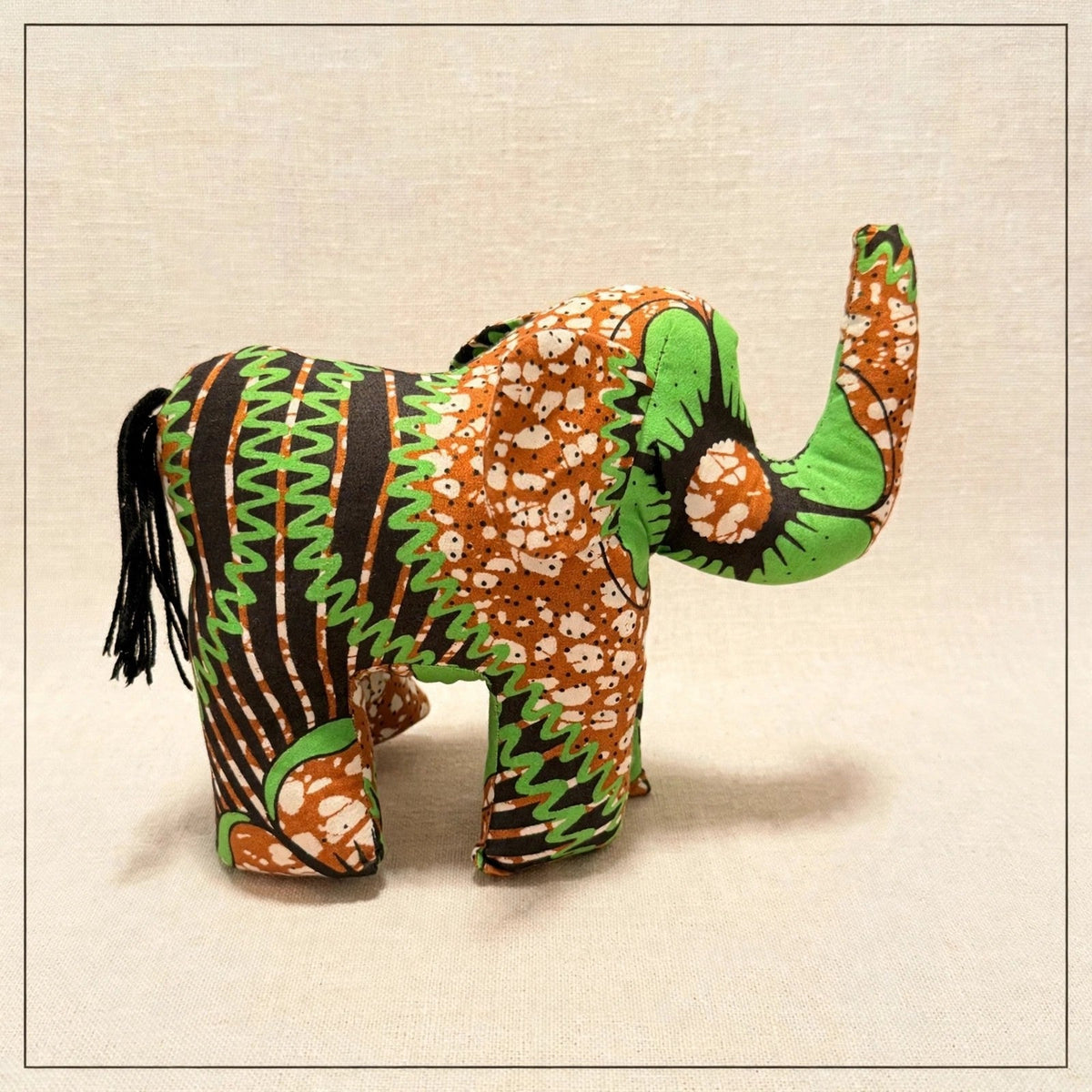Handmade African kente fabric elephant plush from Zanzibar, Tanzania - one of a kind stuffed animal gift for kids