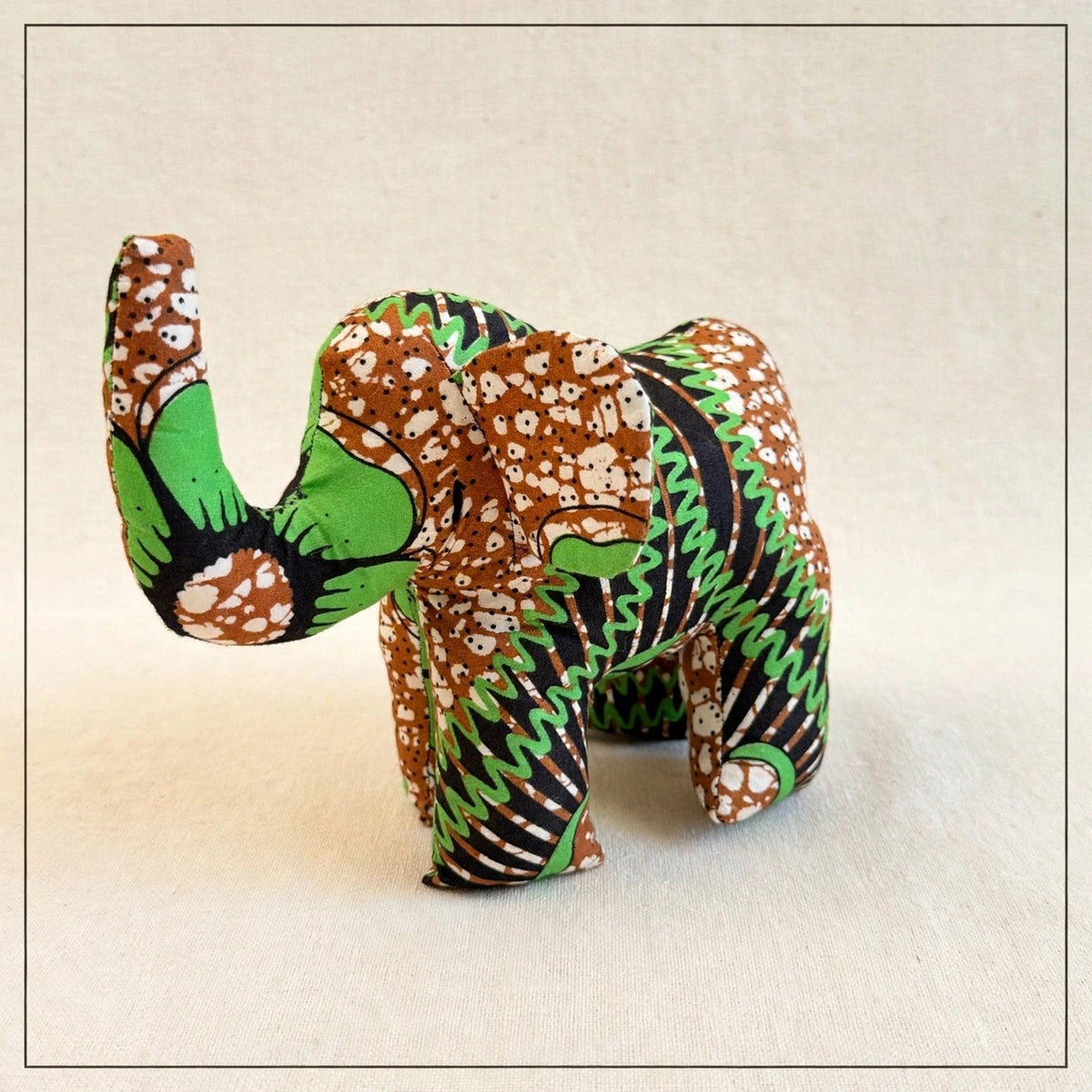 Handmade African kente fabric elephant plush from Zanzibar, Tanzania - one of a kind stuffed animal gift for kids