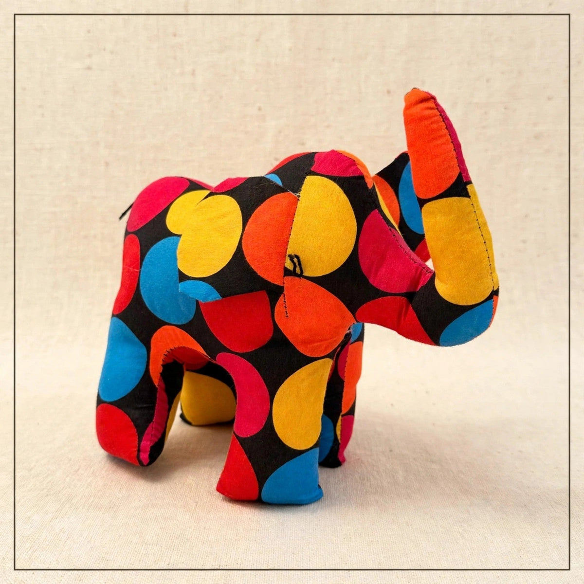 Handmade African kente fabric elephant plush from Zanzibar, Tanzania - one of a kind stuffed animal gift for kids