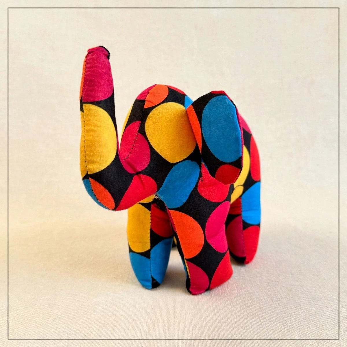 Handmade African kente fabric elephant plush from Zanzibar, Tanzania - one of a kind stuffed animal gift for kids