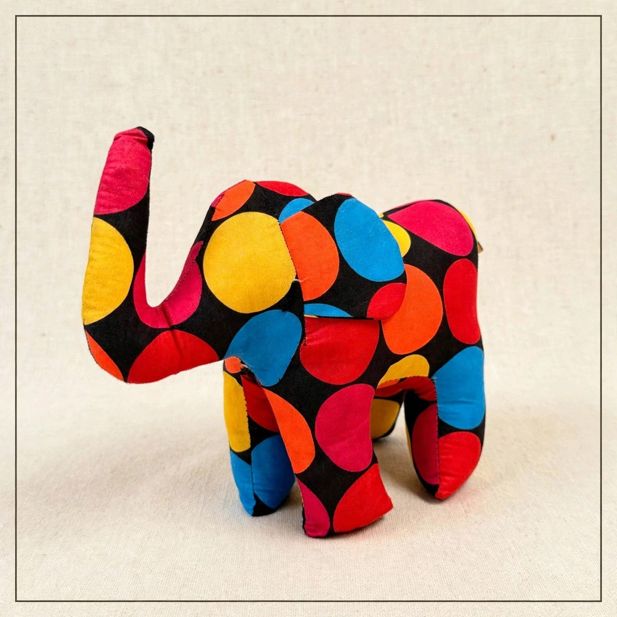 Handmade African kente fabric elephant plush from Zanzibar, Tanzania - one of a kind stuffed animal gift for kids