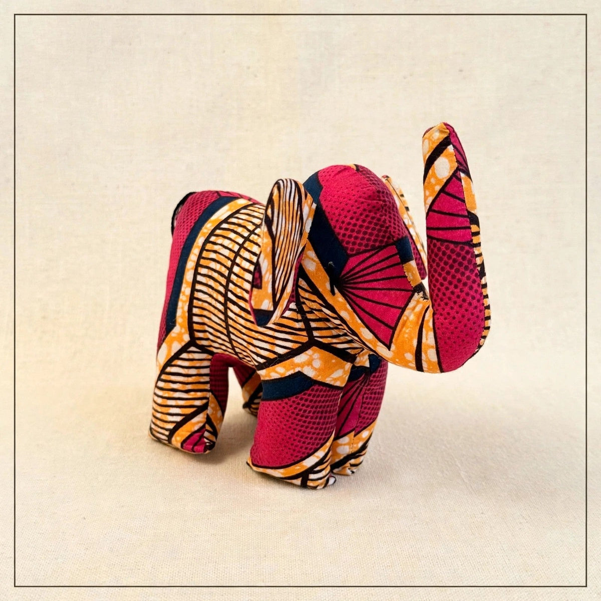 Handmade African kente fabric elephant plush from Zanzibar, Tanzania - one of a kind stuffed animal gift for kids