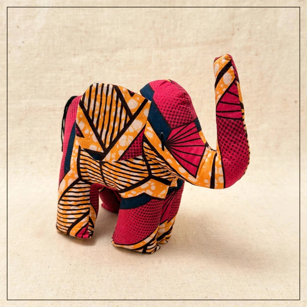 Handmade African kente fabric elephant plush from Zanzibar, Tanzania - one of a kind stuffed animal gift for kids