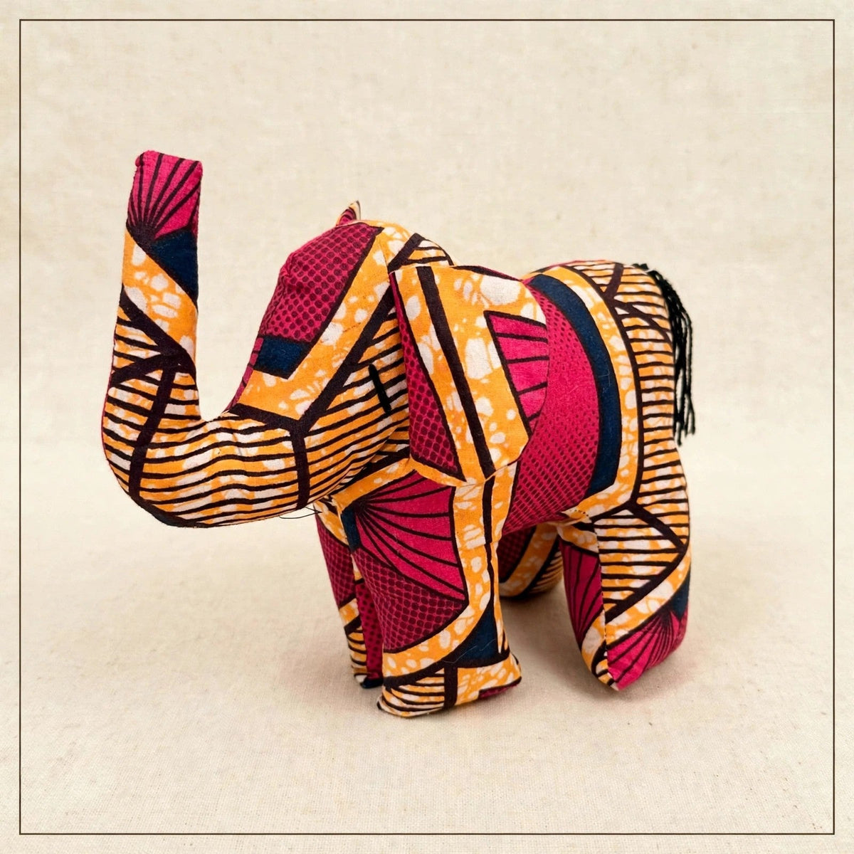 Handmade African kente fabric elephant plush from Zanzibar, Tanzania - one of a kind stuffed animal gift for kids