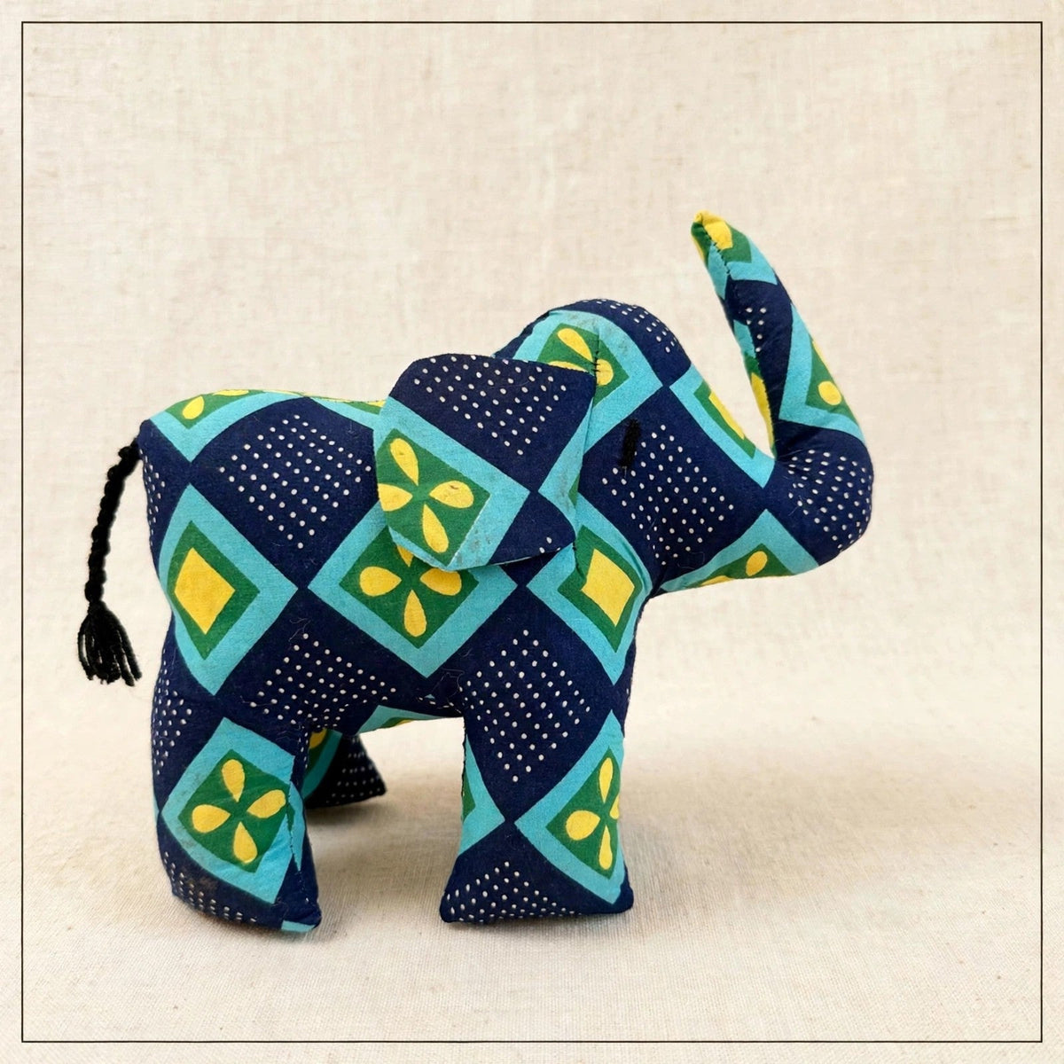 Handmade African kente fabric elephant plush from Zanzibar, Tanzania - one of a kind stuffed animal gift for kids