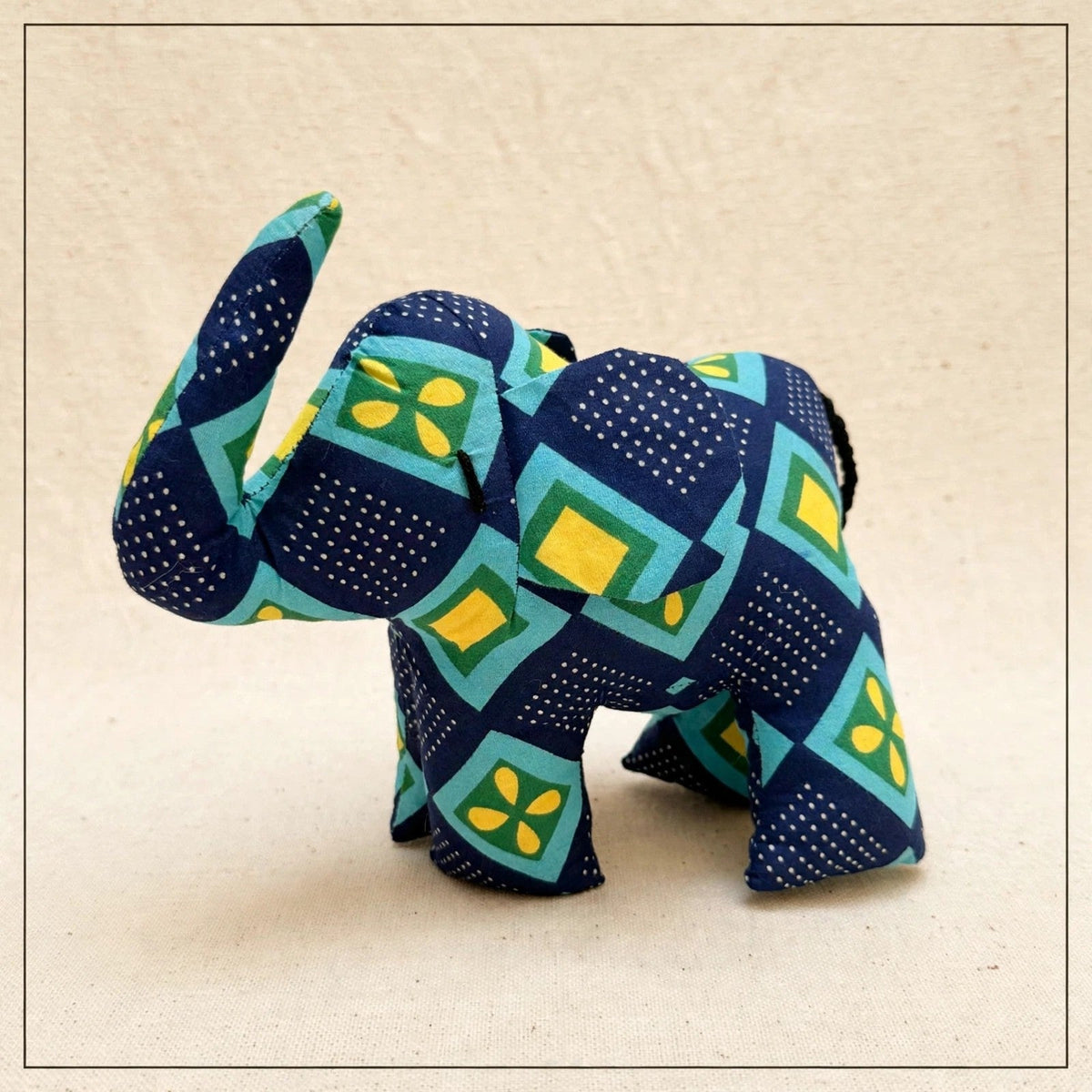 Handmade African kente fabric elephant plush from Zanzibar, Tanzania - one of a kind stuffed animal gift for kids