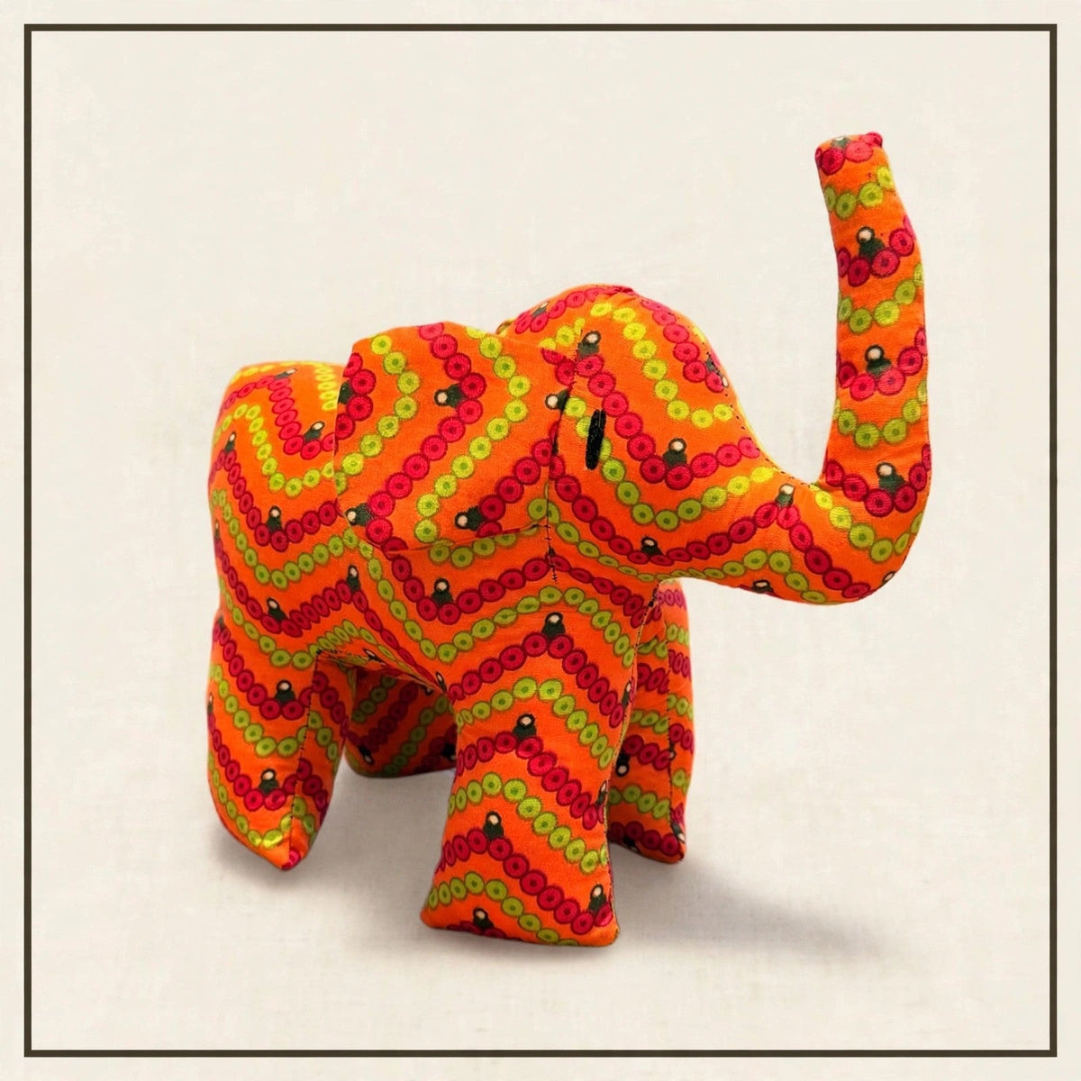 Handmade African kente fabric elephant plush from Zanzibar, Tanzania - one of a kind stuffed animal gift for kids