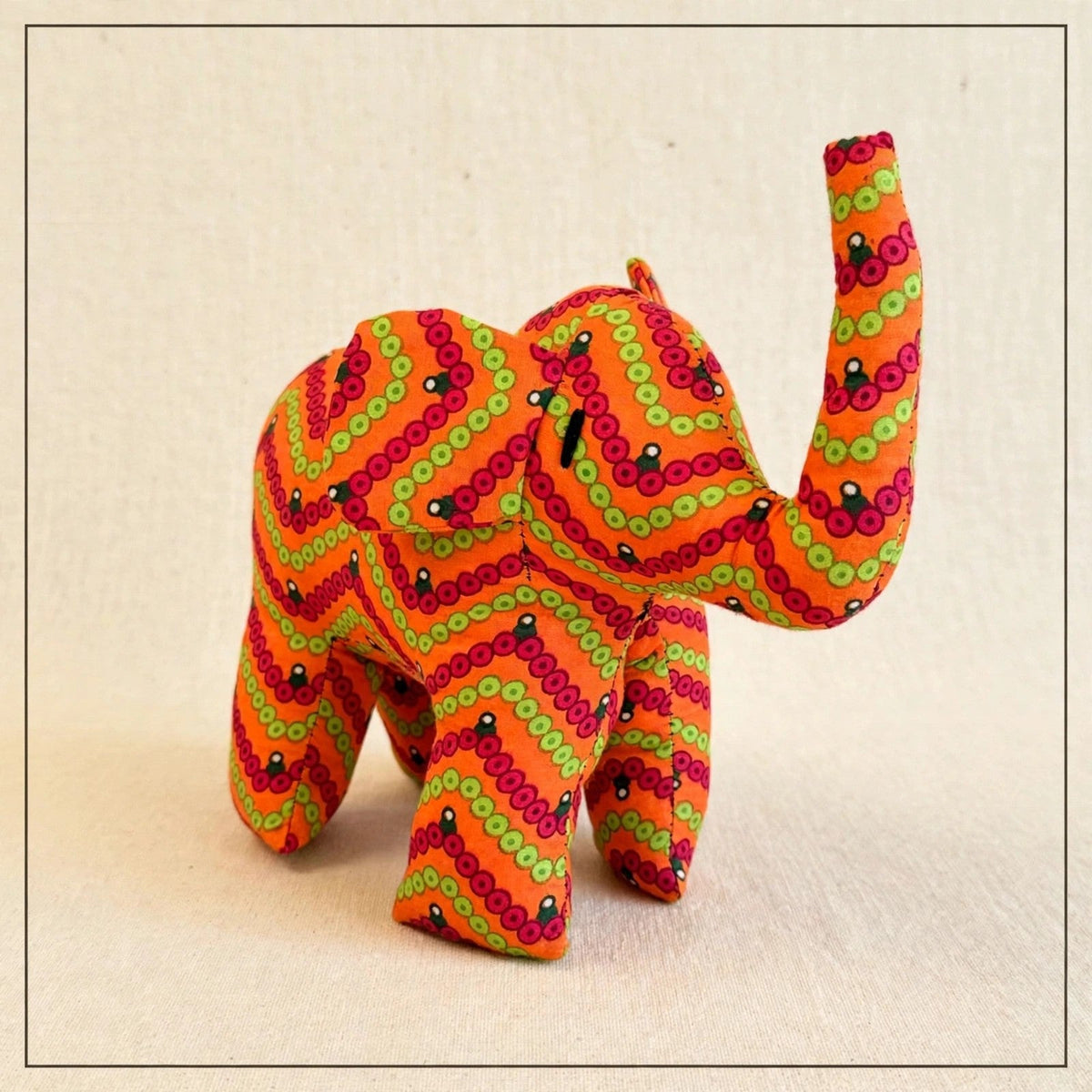 Handmade African kente fabric elephant plush from Zanzibar, Tanzania - one of a kind stuffed animal gift for kids