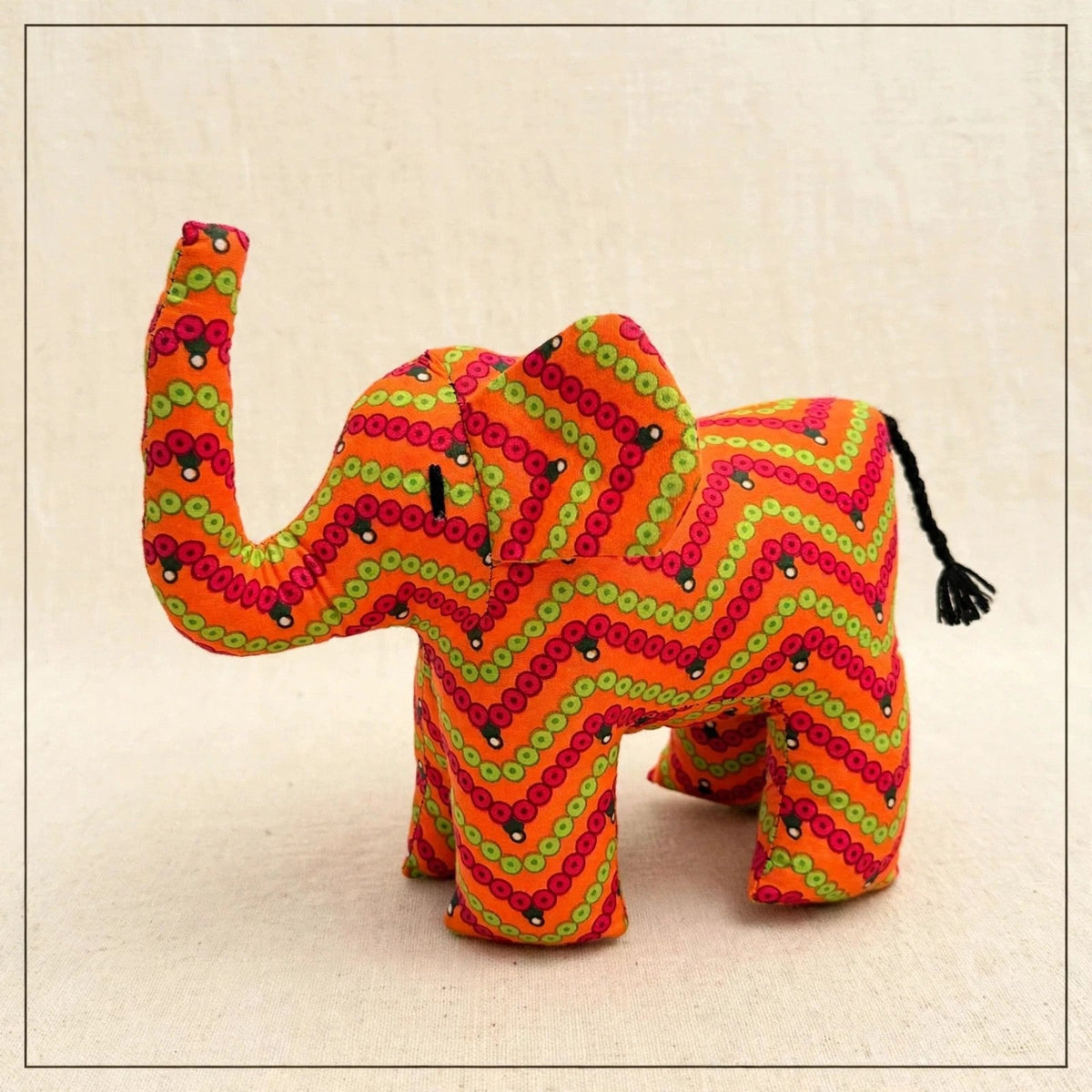 Handmade African kente fabric elephant plush from Zanzibar, Tanzania - one of a kind stuffed animal gift for kids