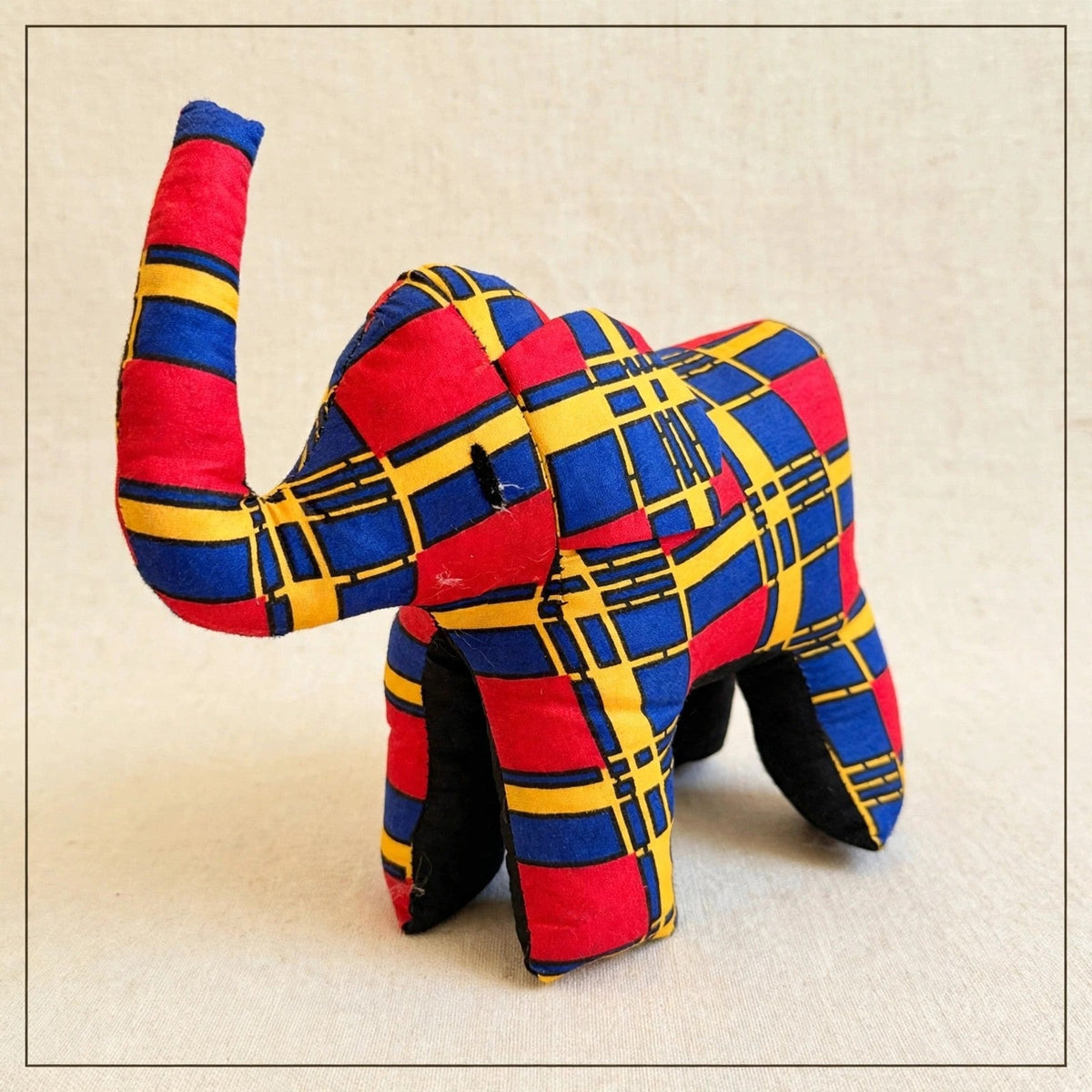 Handmade African kente fabric elephant plush from Zanzibar, Tanzania - one of a kind stuffed animal gift for kids