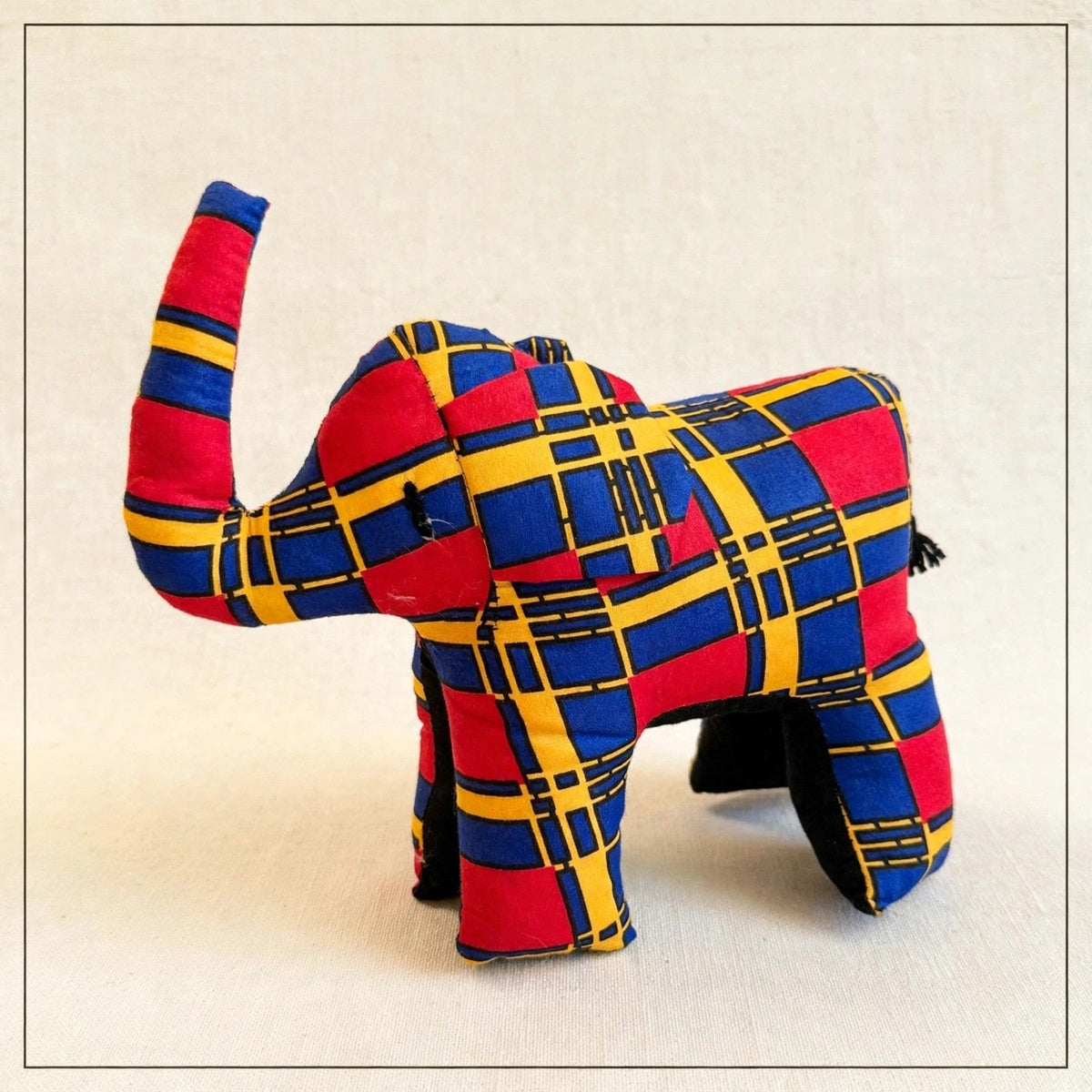 Handmade African kente fabric elephant plush from Zanzibar, Tanzania - one of a kind stuffed animal gift for kids
