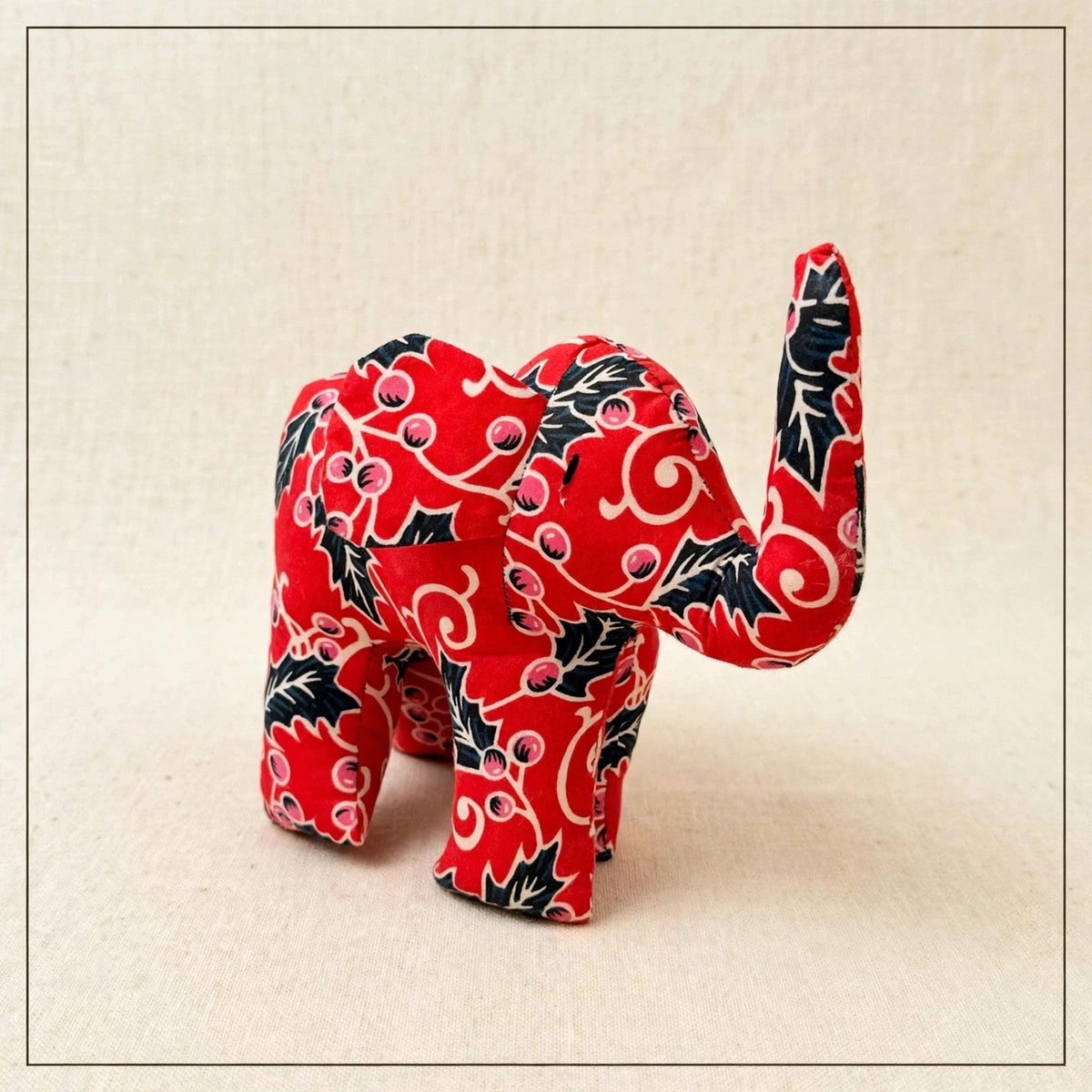 Handmade African kente fabric elephant plush from Zanzibar, Tanzania - one of a kind stuffed animal gift for kids