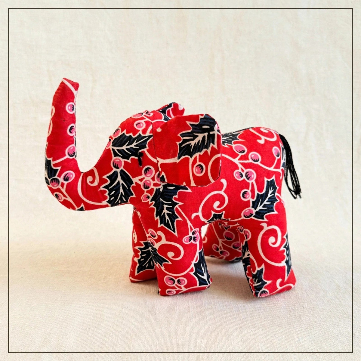 Handmade African kente fabric elephant plush from Zanzibar, Tanzania - one of a kind stuffed animal gift for kids