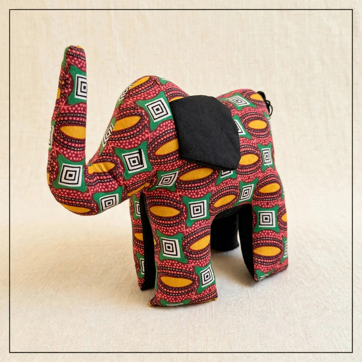 Handmade African kente fabric elephant plush from Zanzibar, Tanzania - one of a kind stuffed animal gift for kids