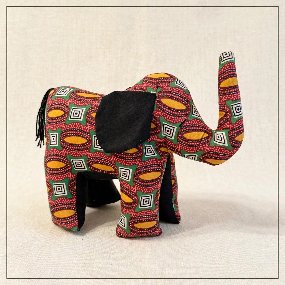 Handmade African kente fabric elephant plush from Zanzibar, Tanzania - one of a kind stuffed animal gift for kids