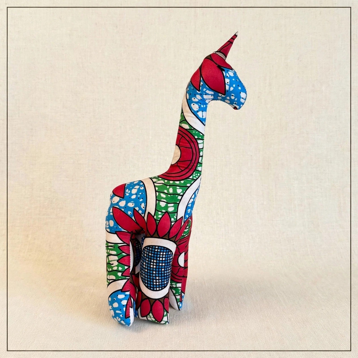 Handmade African kente fabric giraffe plush from Zanzibar, Tanzania - one of a kind stuffed animal gift for kids