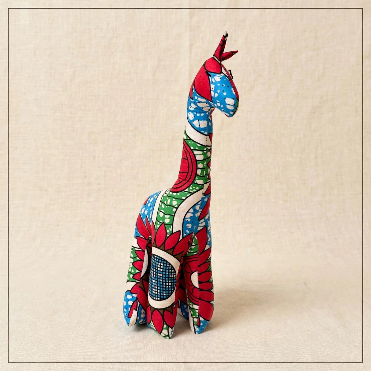 Handmade African kente fabric giraffe plush from Zanzibar, Tanzania - one of a kind stuffed animal gift for kids