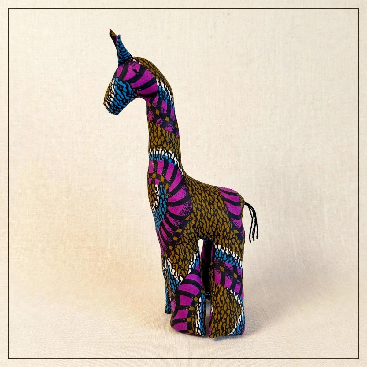 Handmade African kente fabric giraffe plush from Zanzibar, Tanzania - one of a kind stuffed animal gift for kids