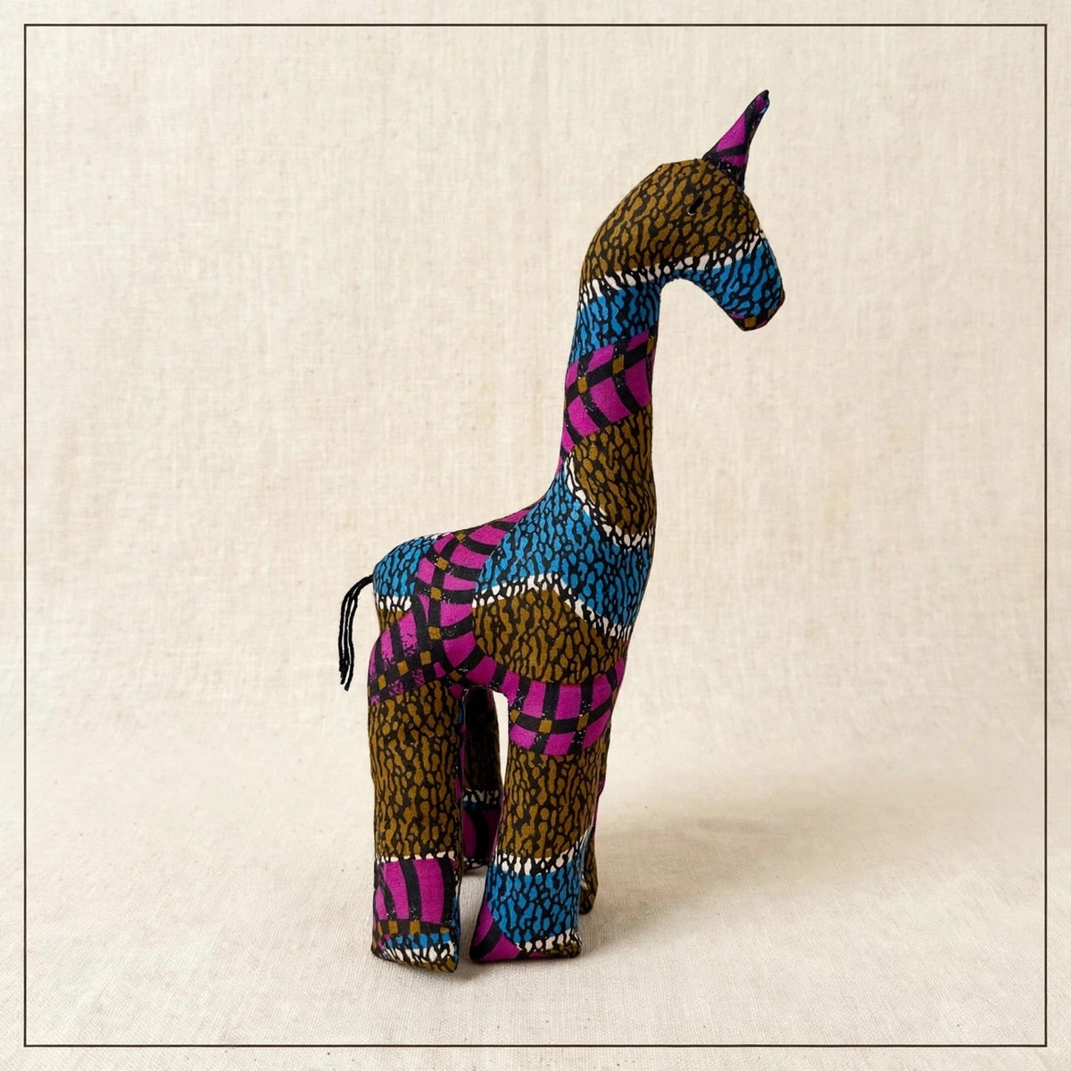 Handmade African kente fabric giraffe plush from Zanzibar, Tanzania - one of a kind stuffed animal gift for kids