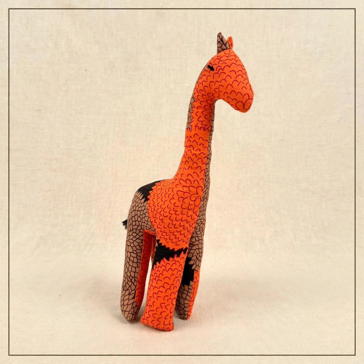 Handmade African kente fabric giraffe plush from Zanzibar, Tanzania - one of a kind stuffed animal gift for kids