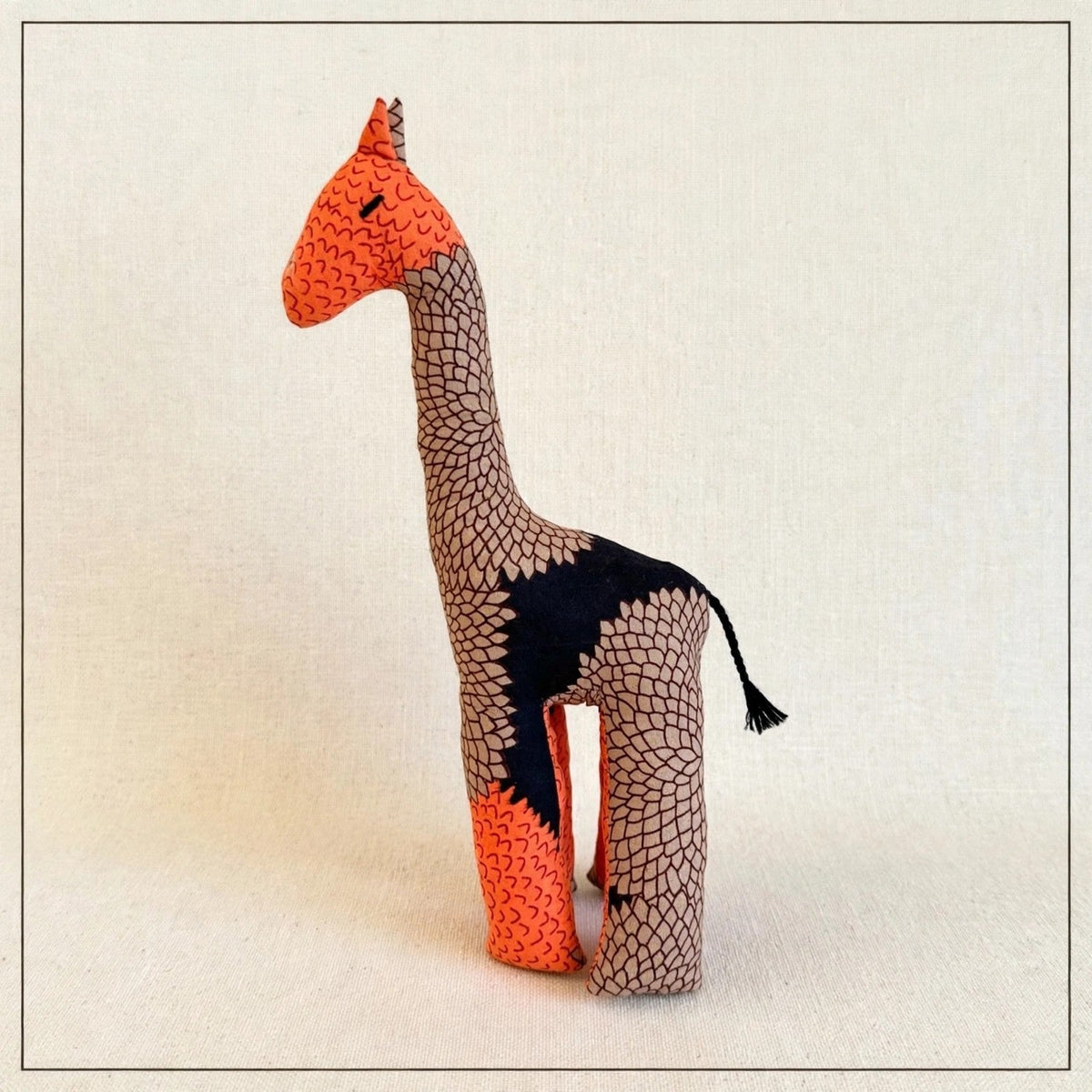 Handmade African kente fabric giraffe plush from Zanzibar, Tanzania - one of a kind stuffed animal gift for kids