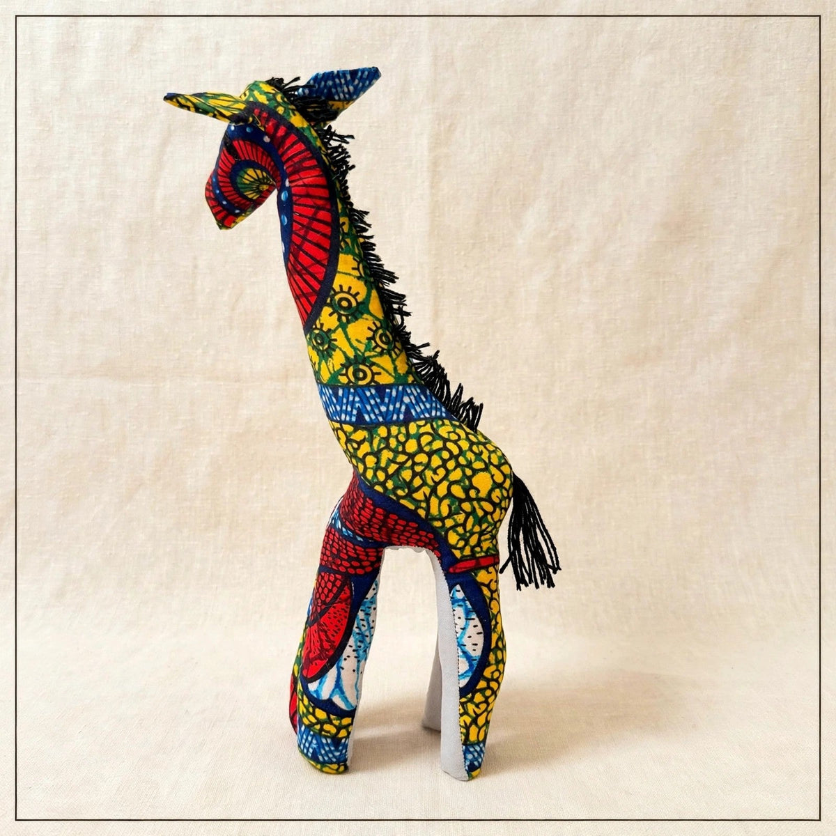 Handmade African kente fabric giraffe plush from Zanzibar, Tanzania - one of a kind stuffed animal gift for kids