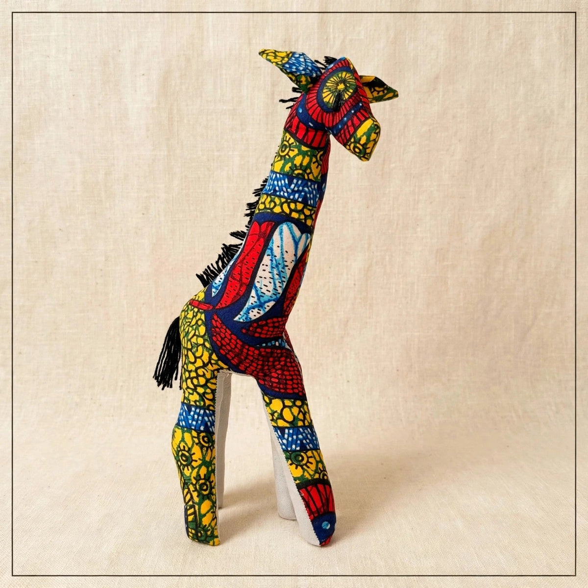 Handmade African kente fabric giraffe plush from Zanzibar, Tanzania - one of a kind stuffed animal gift for kids