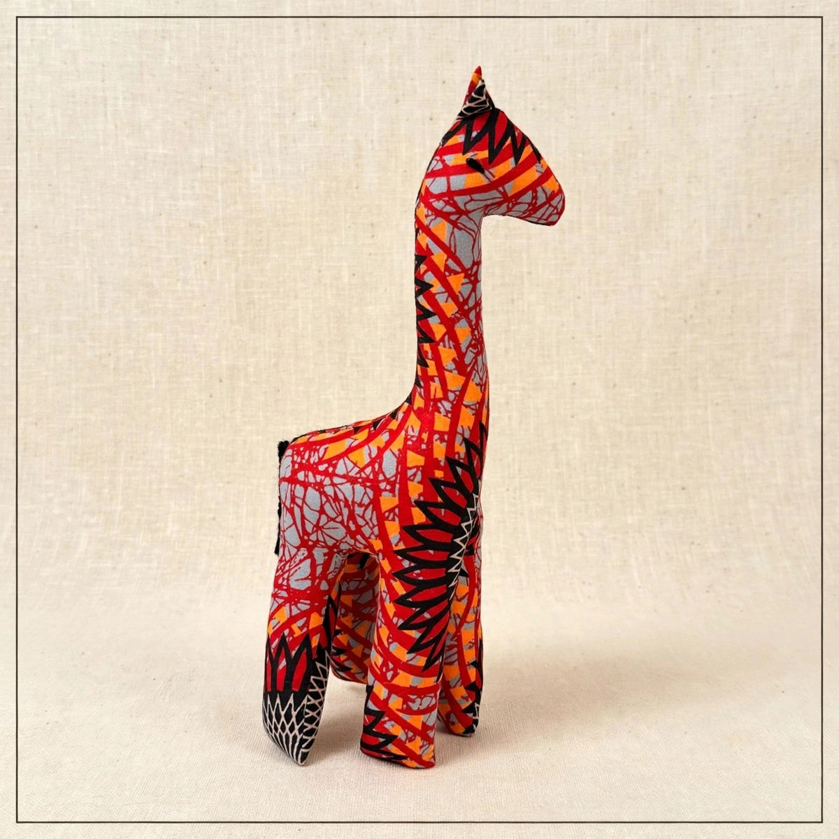 Handmade African kente fabric giraffe plush from Zanzibar, Tanzania - one of a kind stuffed animal gift for kids