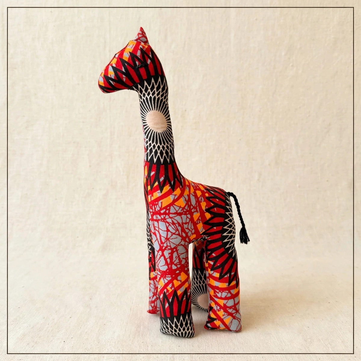 Handmade African kente fabric giraffe plush from Zanzibar, Tanzania - one of a kind stuffed animal gift for kids