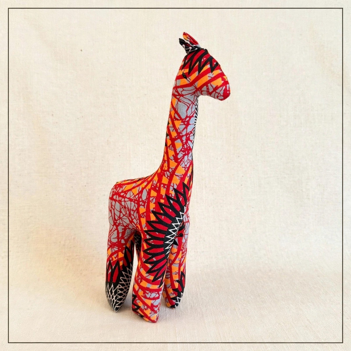Handmade African kente fabric giraffe plush from Zanzibar, Tanzania - one of a kind stuffed animal gift for kids