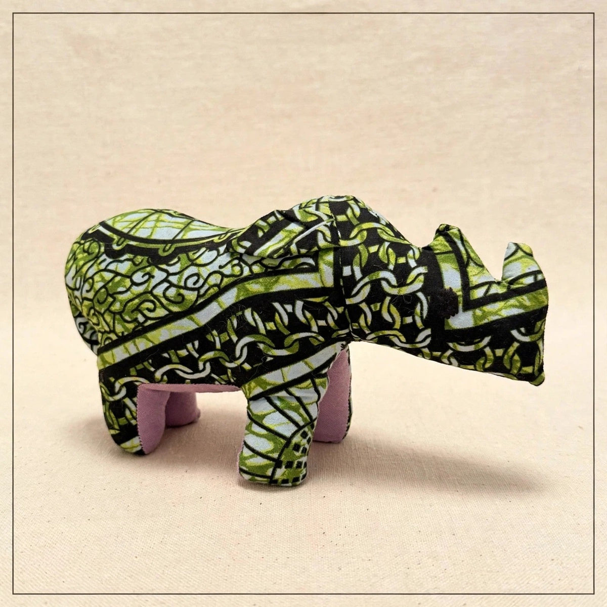 Handmade African kente fabric rhino plush from Zanzibar, Tanzania - one of a kind stuffed animal gift for kids