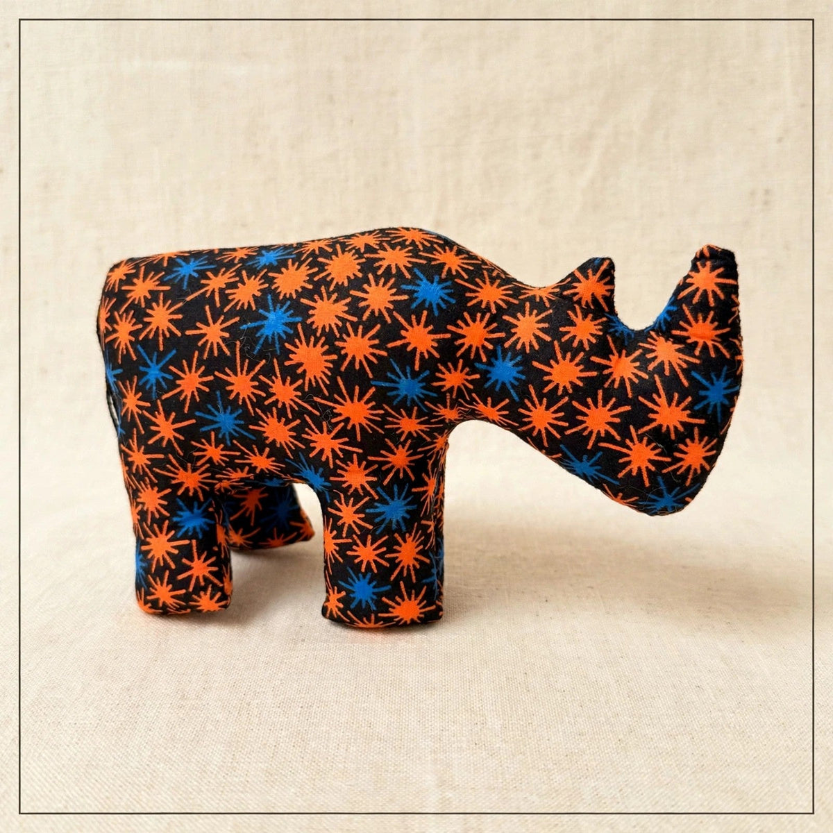 Handmade African kente fabric rhino plush from Zanzibar, Tanzania - one of a kind stuffed animal gift for kids