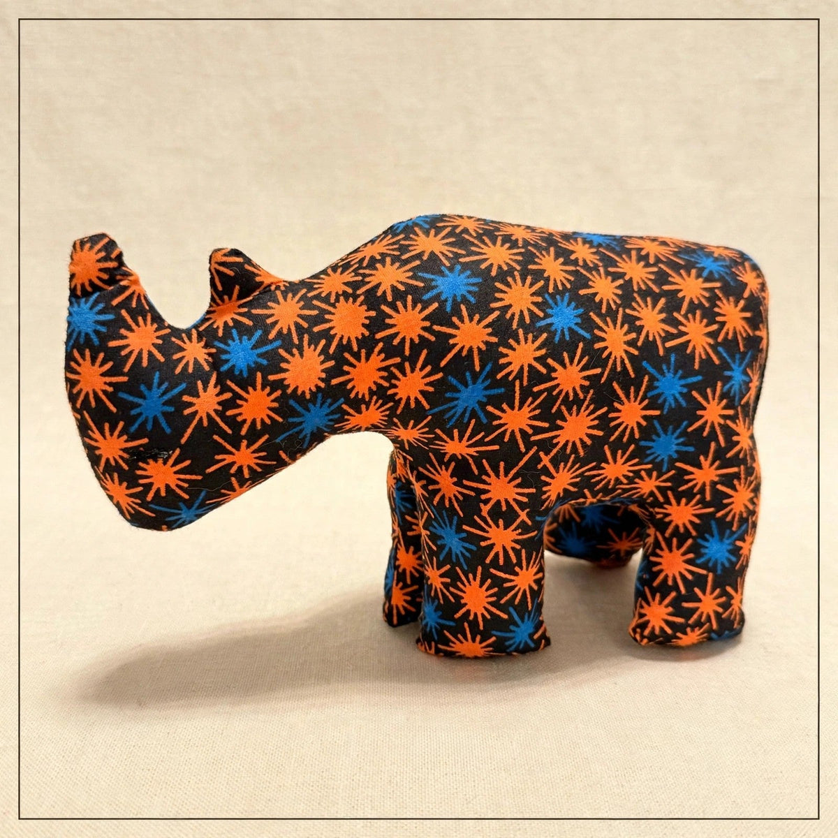 Handmade African kente fabric rhino plush from Zanzibar, Tanzania - one of a kind stuffed animal gift for kids