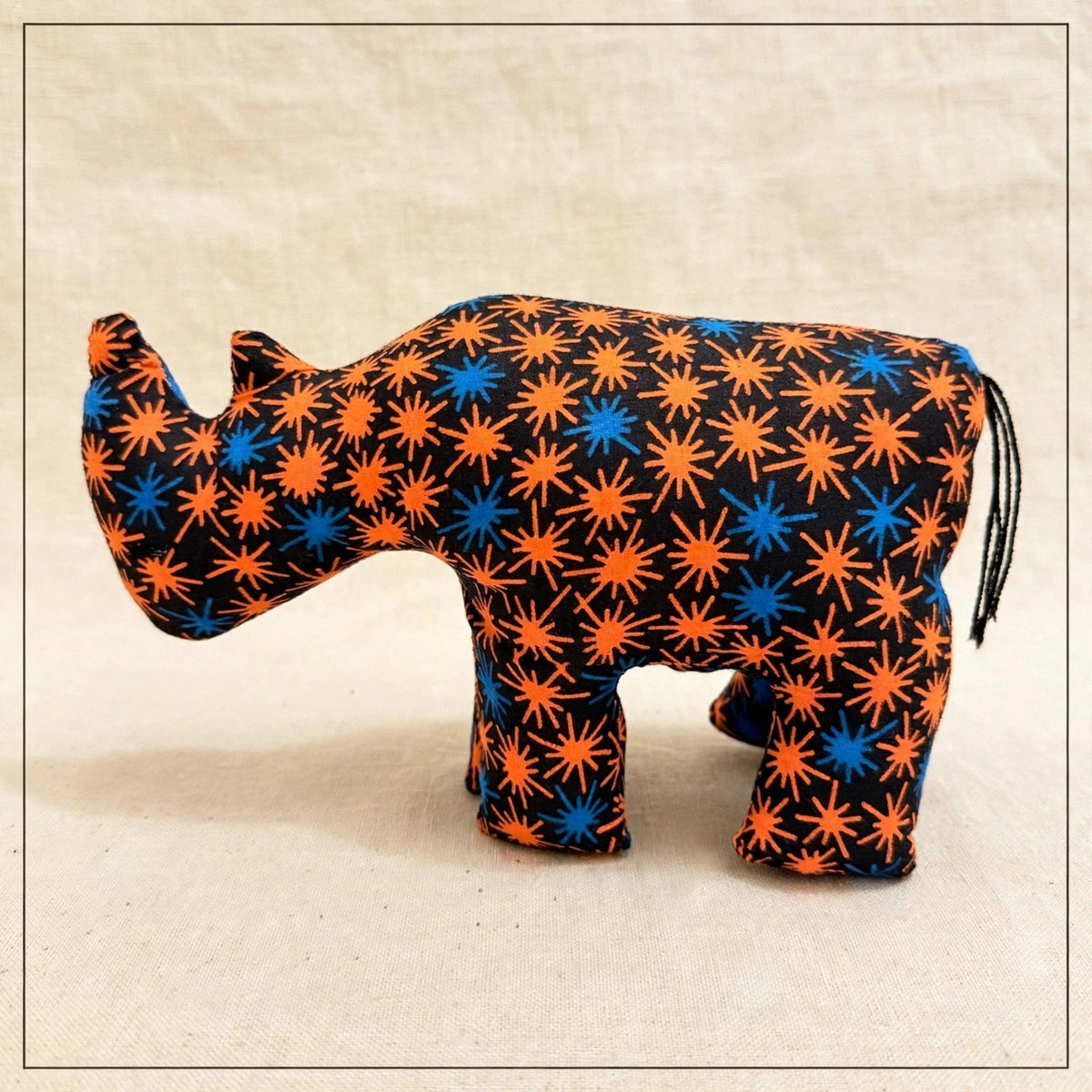 Handmade African kente fabric rhino plush from Zanzibar, Tanzania - one of a kind stuffed animal gift for kids