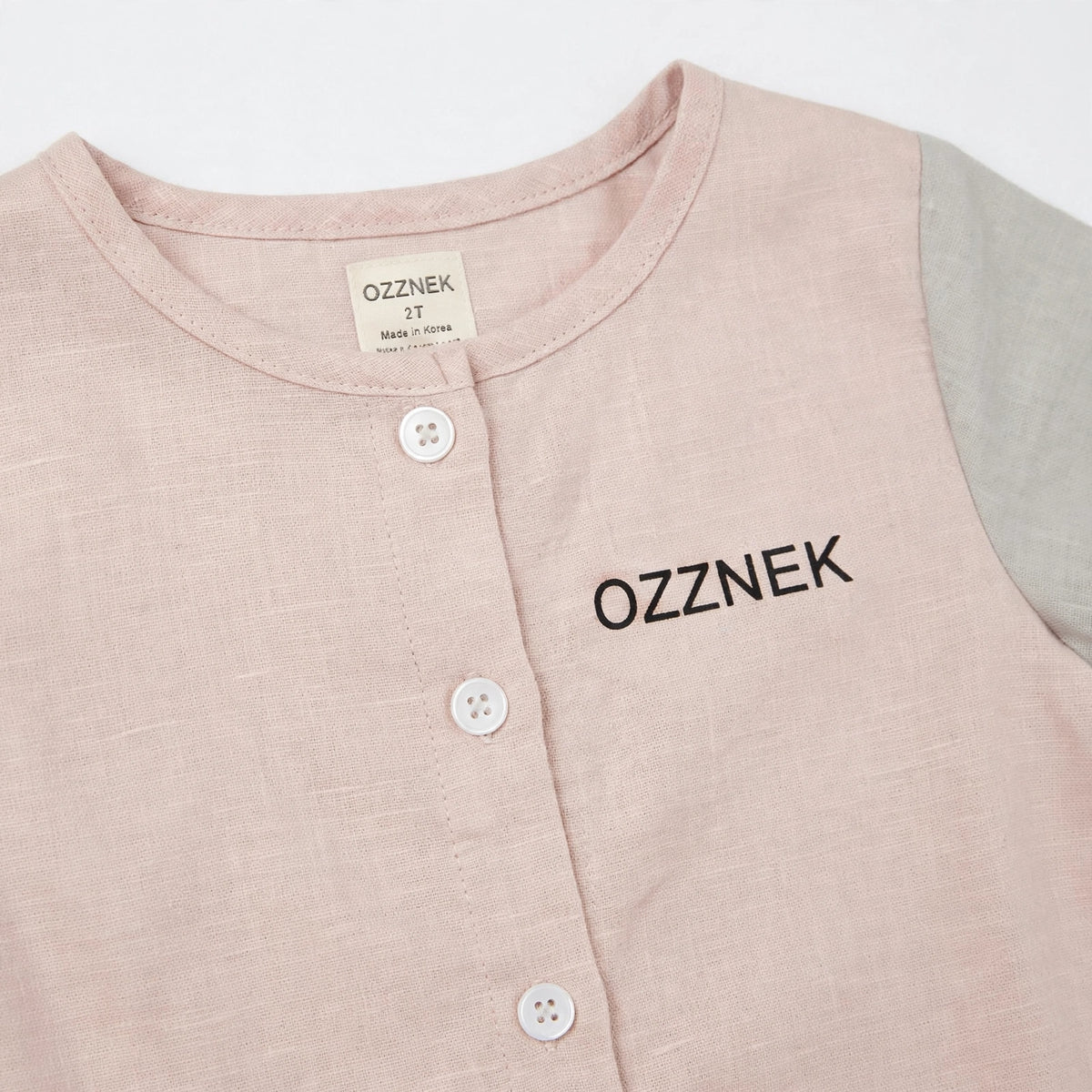 Toddler Organic Cotton Linen Button-Up Shirt - detail close-up, white studio photo